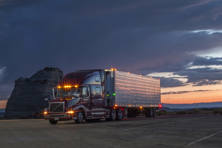 American Truck diagonal view in sunset with dark cloud